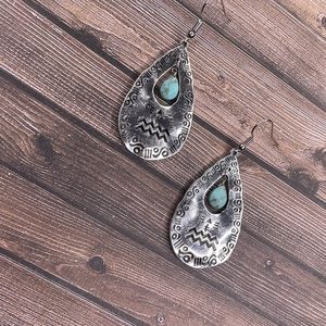 Dangle earrings with turquoise bead